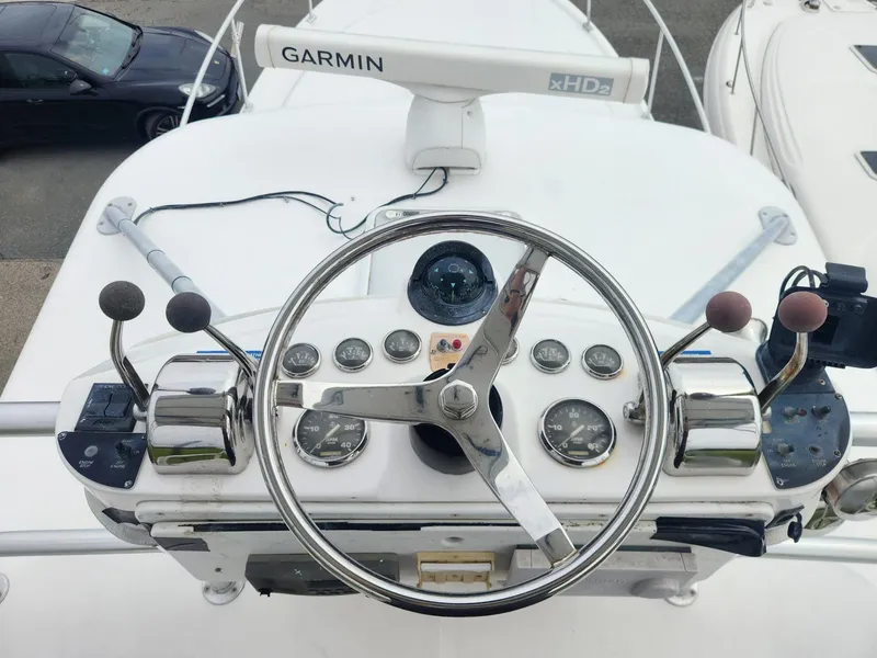 Slide: The Image of 2003 Luhrs 30 Open boat helm with Garmin xHD2 radar and control gauges. - 5