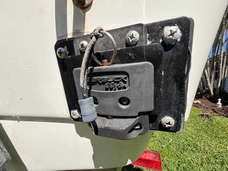 Slide: The Image of Close-up of a 2013 SeaHunter 24 Bay boat's transom with a mounted lock mechanism. - 11