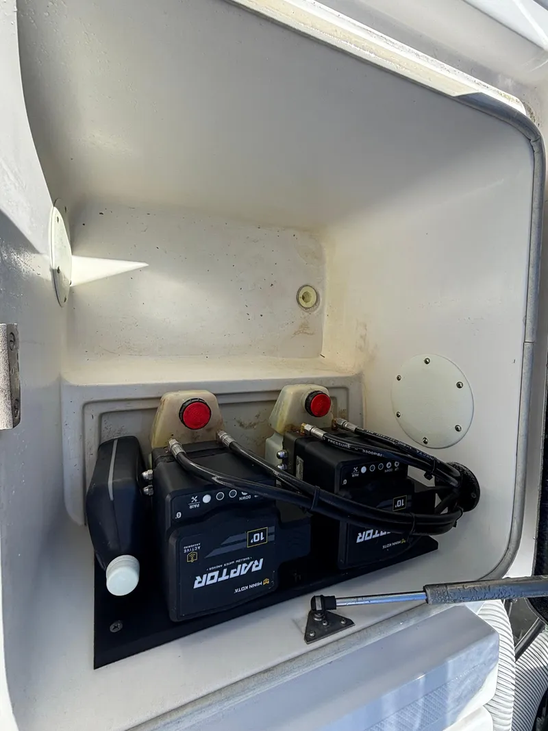 Slide: The Image of 2013 SeaHunter 24 Bay boat battery compartment with dual batteries. - 30