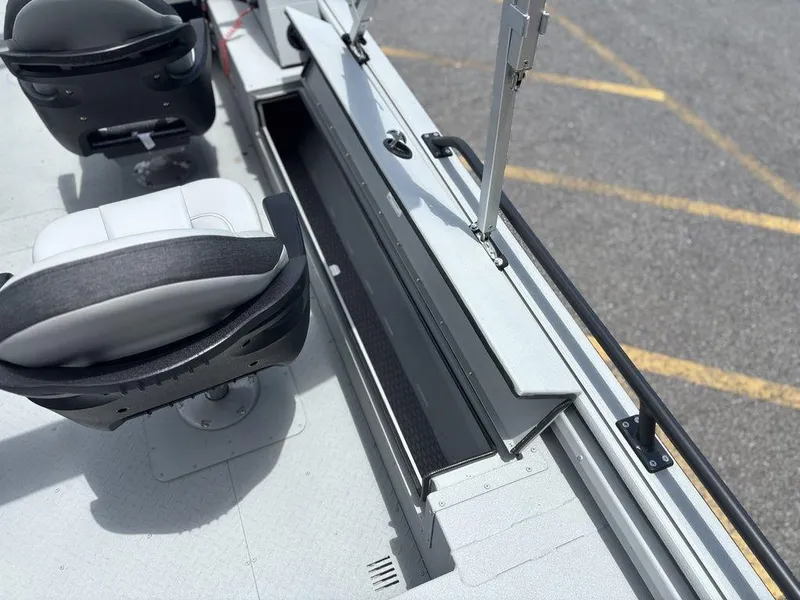 Slide: The Image of 2026 SeaArk ProCat 240 boat interior with seating and storage compartments. - 14