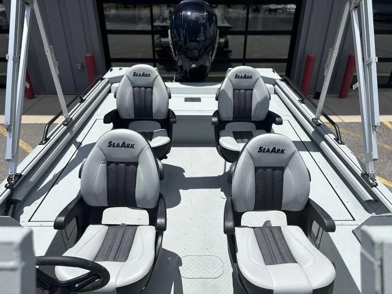 Slide: The Image of 2026 SeaArk ProCat 240 boat interior with four seats and steering wheel. - 17
