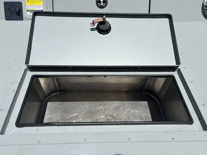 Slide: The Image of Open storage compartment on 2026 SeaArk ProCat 240 boat. - 18