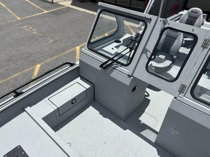 Slide: The Image of 2026 SeaArk ProCat 240 boat interior with seating and storage compartments. - 20
