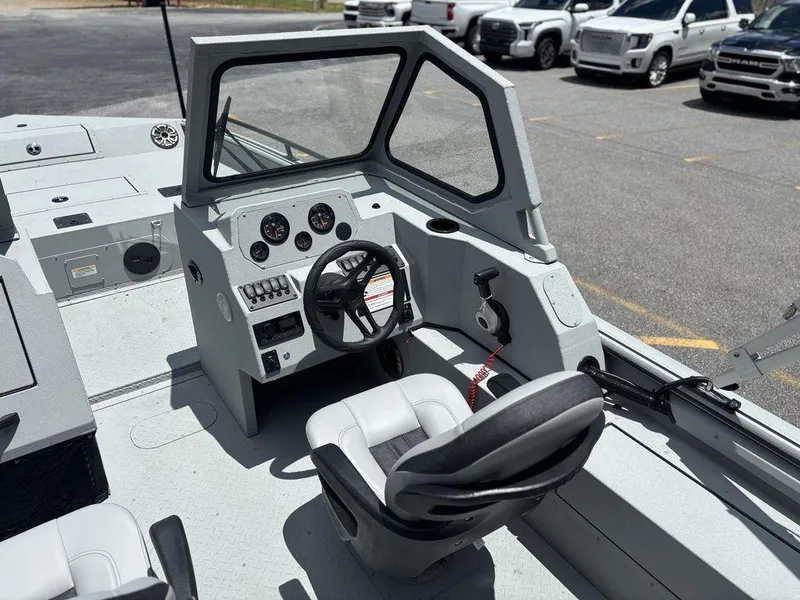 Slide: The Image of 2026 SeaArk ProCat 240 boat interior with steering console and seating. - 21