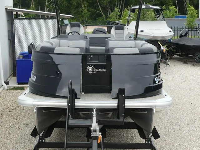 Slide: The Image of 2023 Massimo Marine LIMITED boat on trailer, gray color. - 16