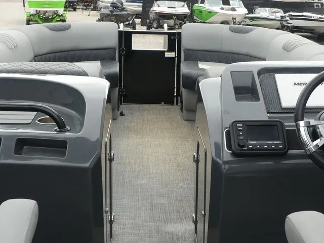 Slide: The Image of Interior of 2023 Massimo Marine LIMITED boat, gray upholstery and helm console. - 29