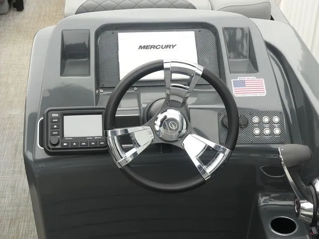 Slide: The Image of Dashboard of a 2023 Massimo Marine LIMITED boat with Mercury logo. - 35