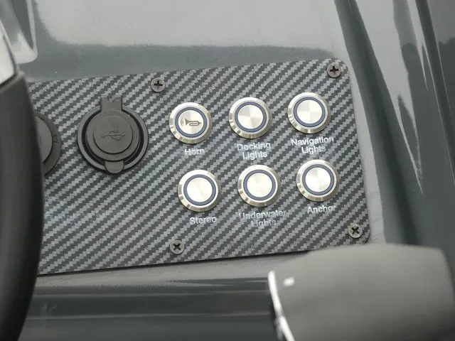 Slide: The Image of Control panel of a 2023 Massimo Marine LIMITED boat with switches. - 38