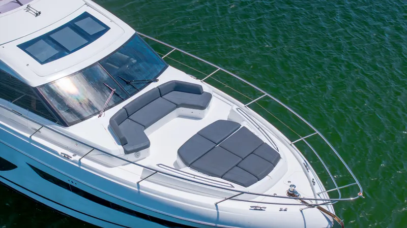 Slide: The Image of Luxurious 2017 Princess S65 yacht with spacious sunbathing area on calm green waters. - 5