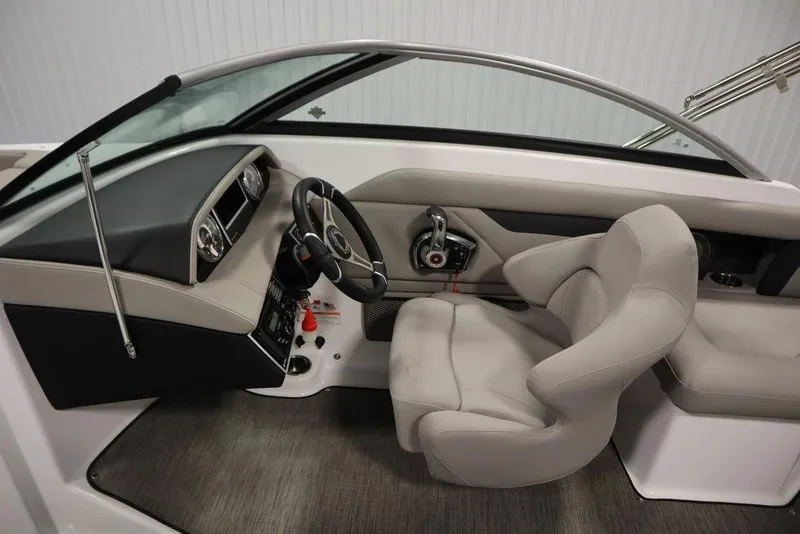 Slide: The Image of 2025 Four Winns HD3 boat interior with sleek dashboard and comfortable seating. - 14