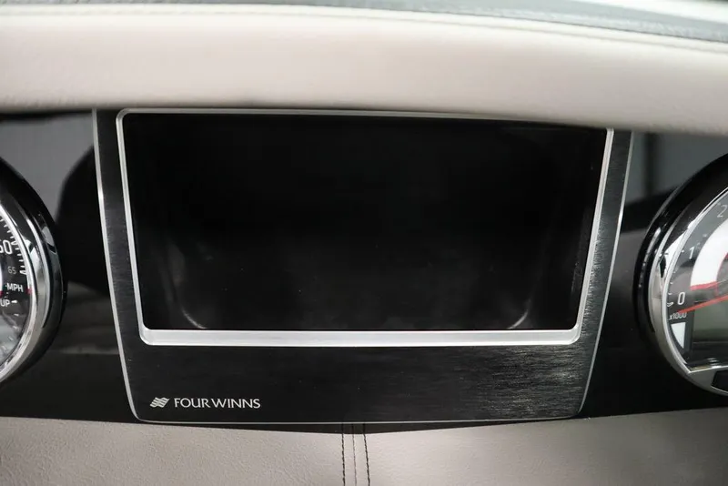 Slide: The Image of 2025 Four Winns HD3 dashboard with speedometer and tachometer. - 16