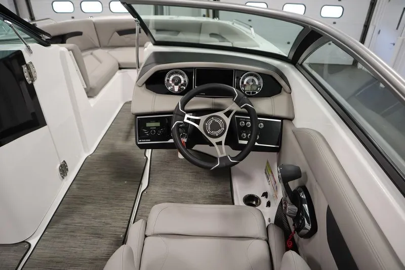 Slide: The Image of 2025 Four Winns HD3 boat interior with modern steering and dashboard design. - 19