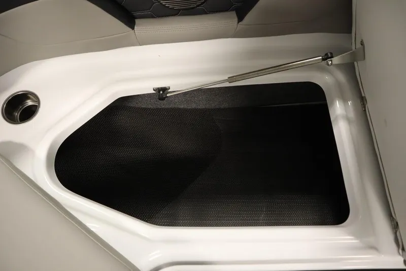 Slide: The Image of 2025 Four Winns HD3 boat storage compartment with hydraulic lift and cup holder. - 21