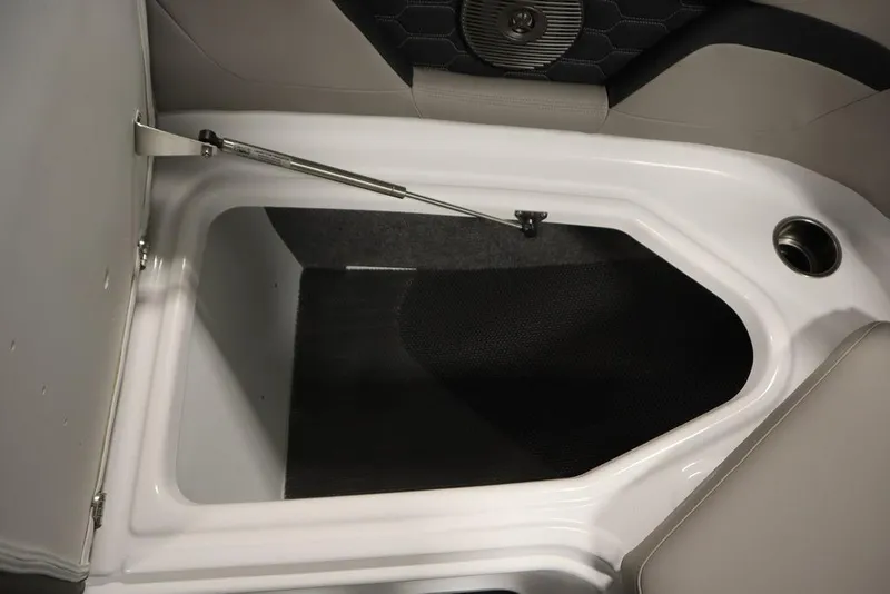 Slide: The Image of 2025 Four Winns HD3 boat storage compartment with hydraulic lift and cup holder. - 22