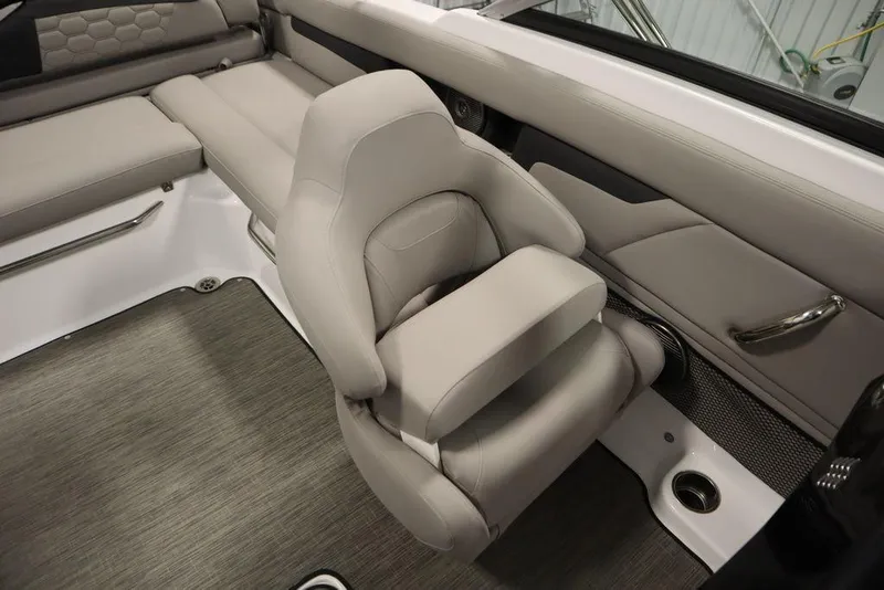 Slide: The Image of 2025 Four Winns HD3 boat interior with luxurious beige seating and modern design. - 27