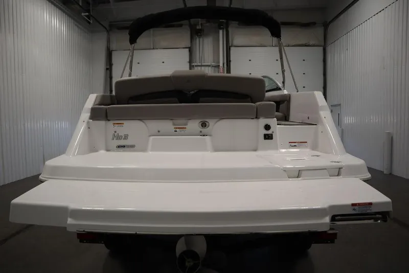Slide: The Image of 2025 Four Winns HD3 boat, rear view in a storage facility. - 3