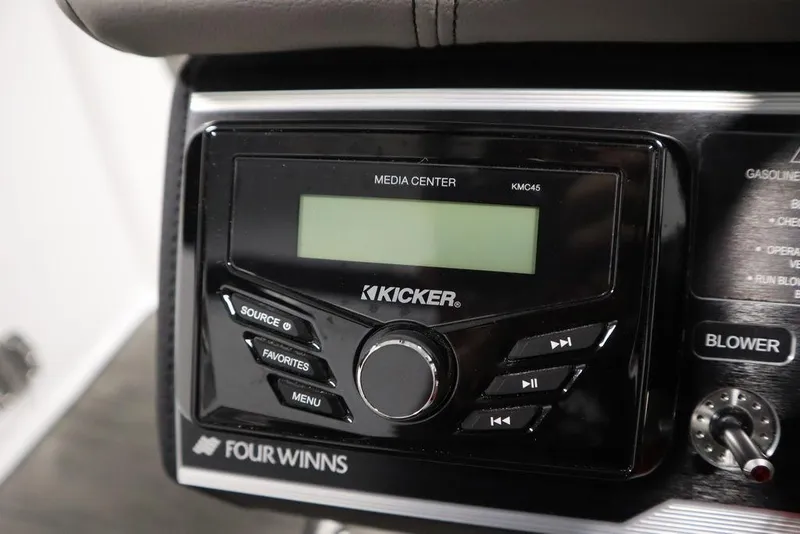 Slide: The Image of 2025 Four Winns HD3 boat media center with Kicker KMC45 audio system. - 32