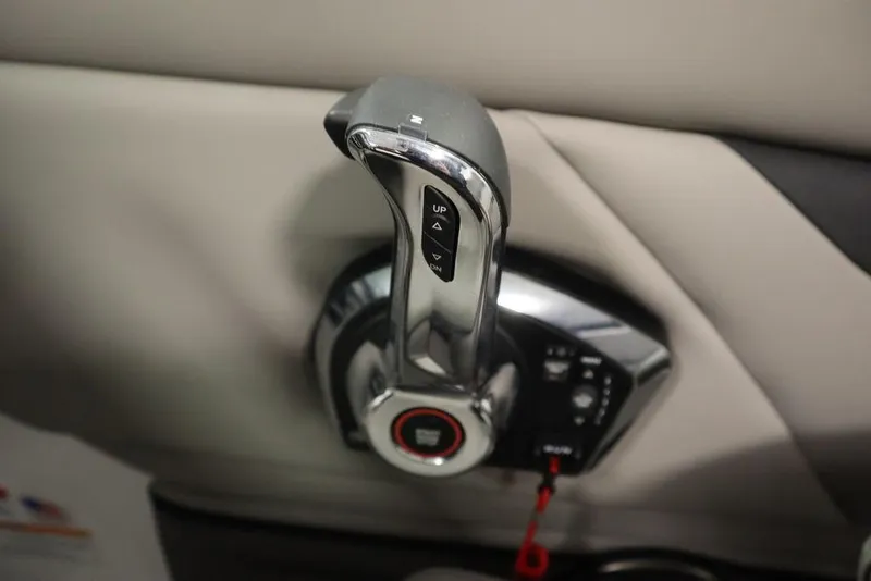 Slide: The Image of 2025 Four Winns HD3 boat throttle control lever, close-up view. - 33