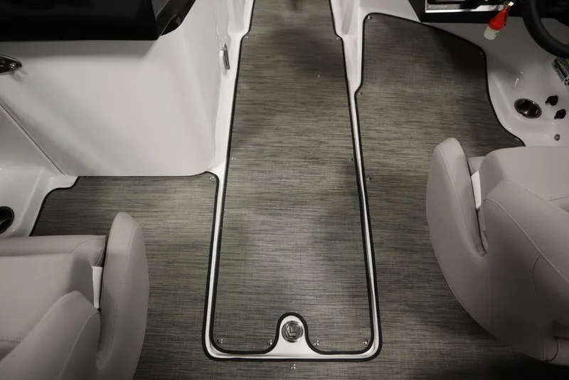Slide: The Image of Interior of 2025 Four Winns HD3 boat, featuring sleek seating and modern flooring. - 34