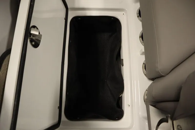Slide: The Image of Open storage compartment in 2025 Four Winns HD3 boat, featuring sleek design and ample space. - 37