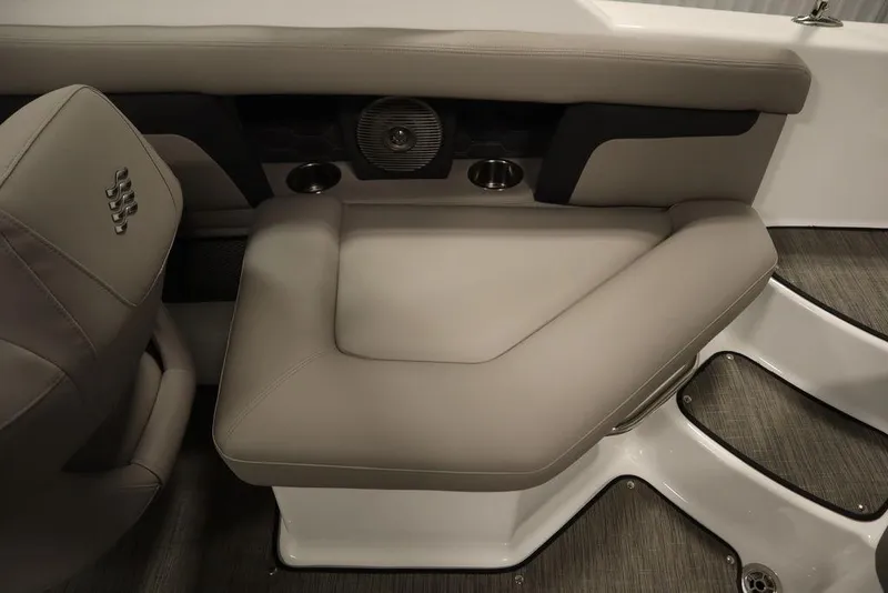 Slide: The Image of 2025 Four Winns HD3 boat interior with cushioned seating and integrated speaker system. - 41