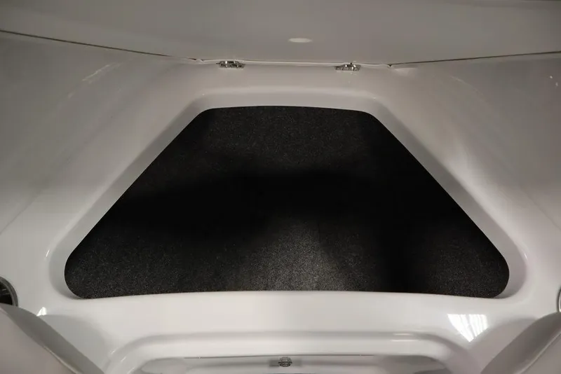 Slide: The Image of Interior view of 2025 Four Winns H2 Freedom boat storage compartment. - 14