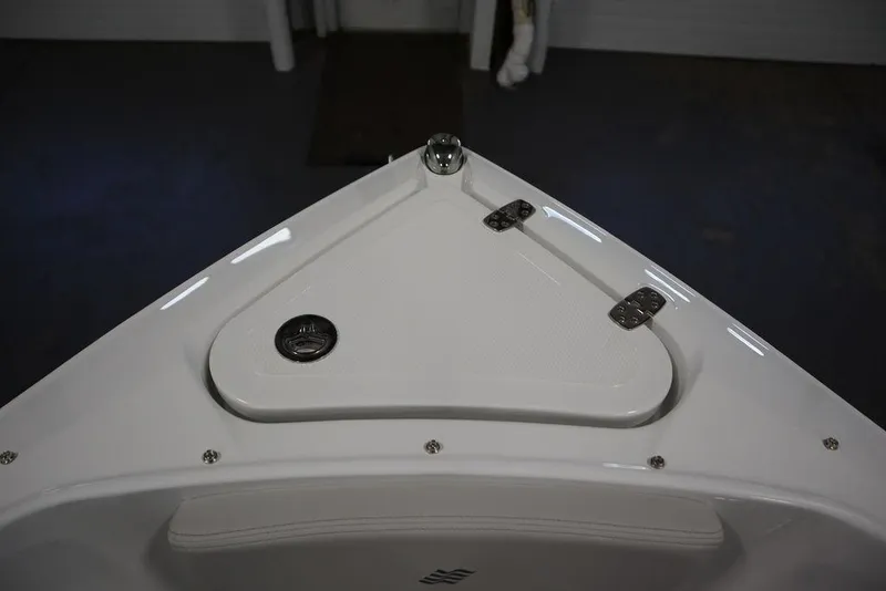 Slide: The Image of Bow of 2025 Four Winns H2 Freedom boat with storage compartment and sleek design. - 18