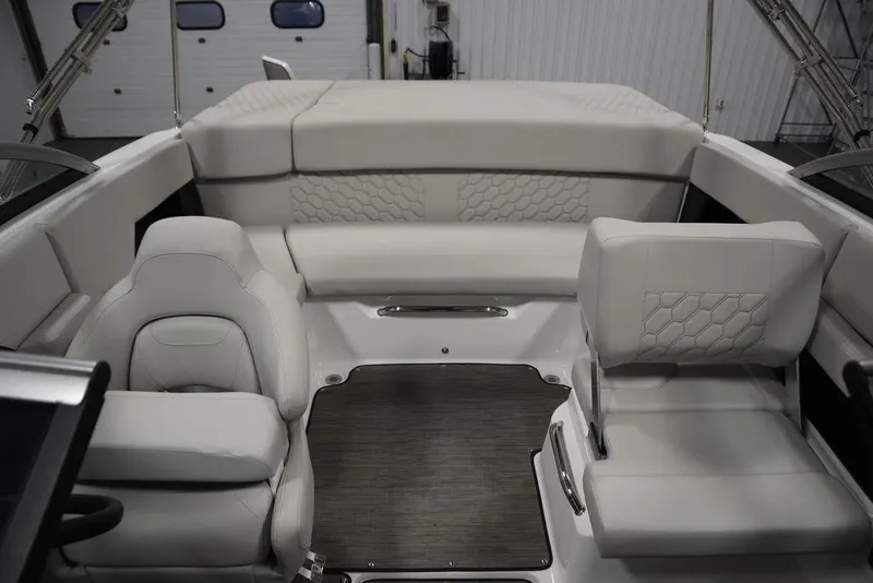 Slide: The Image of 2025 Four Winns H2 Freedom boat interior with luxurious seating and modern design. - 22