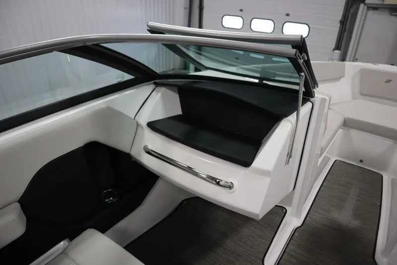 Slide: The Image of 2025 Four Winns H2 Freedom boat interior with sleek design and modern features. - 26