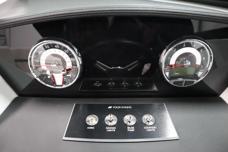 Slide: The Image of Dashboard of 2025 Four Winns H2 Freedom boat with gauges and control panel. - 30