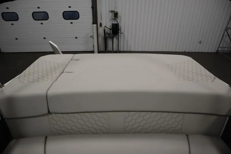 Slide: The Image of 2025 Four Winns H2 Freedom boat interior with hexagonal pattern upholstery. - 35