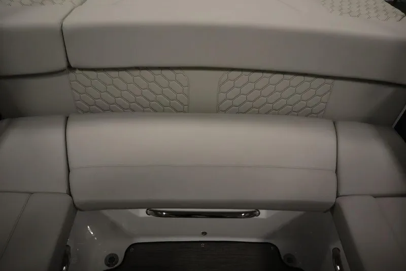 Slide: The Image of 2025 Four Winns H2 Freedom boat interior seating with hexagonal pattern upholstery. - 42