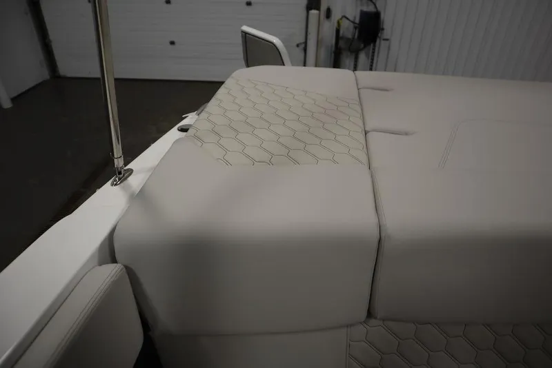 Slide: The Image of 2025 Four Winns H2 Freedom boat interior with hexagonal pattern upholstery. - 47