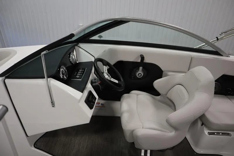 Slide: The Image of Interior of 2025 Four Winns H2 Freedom boat, featuring sleek dashboard and comfortable seating. - 8