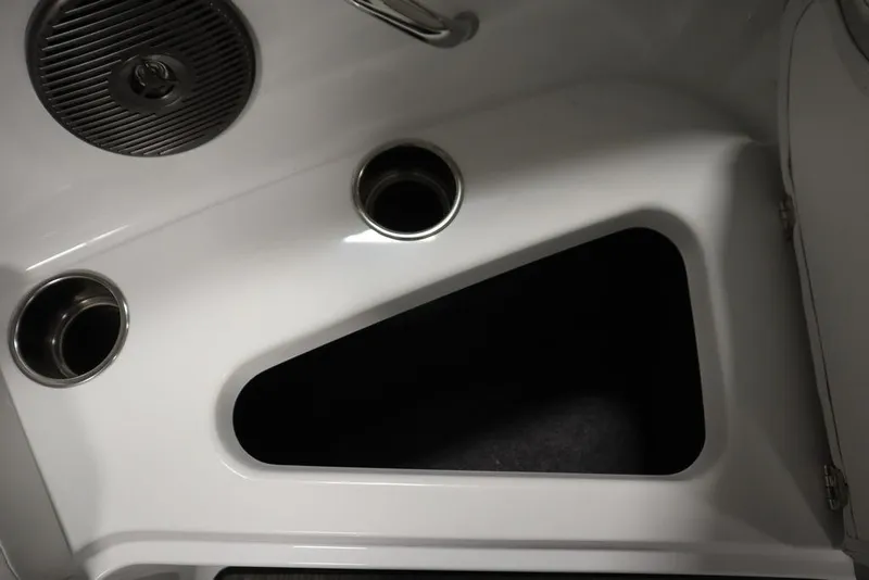 Slide: The Image of Interior detail of 2025 Four Winns H2 Freedom boat, featuring cup holders and speaker. - 9