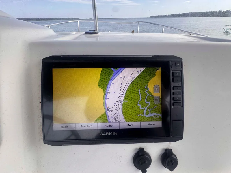 Slide: The Image of Garmin navigation system on 2014 Boston Whaler 210 Montauk boat, displaying a detailed map. - 9