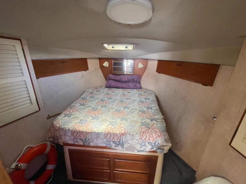 Slide: The Image of Engine compartment of a 1989 Ocean Yachts 35 Super Sport, showcasing mechanical components. - 17