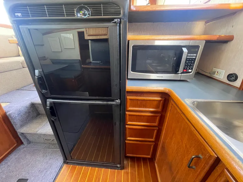 Slide: The Image of Galley kitchen in 1989 Ocean Yachts 35 Super Sport with sink and dish racks. - 11