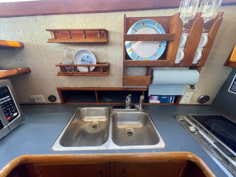 Slide: The Image of Interior of 1989 Ocean Yachts 35 Super Sport with cozy dining area and cushioned seating. - 12