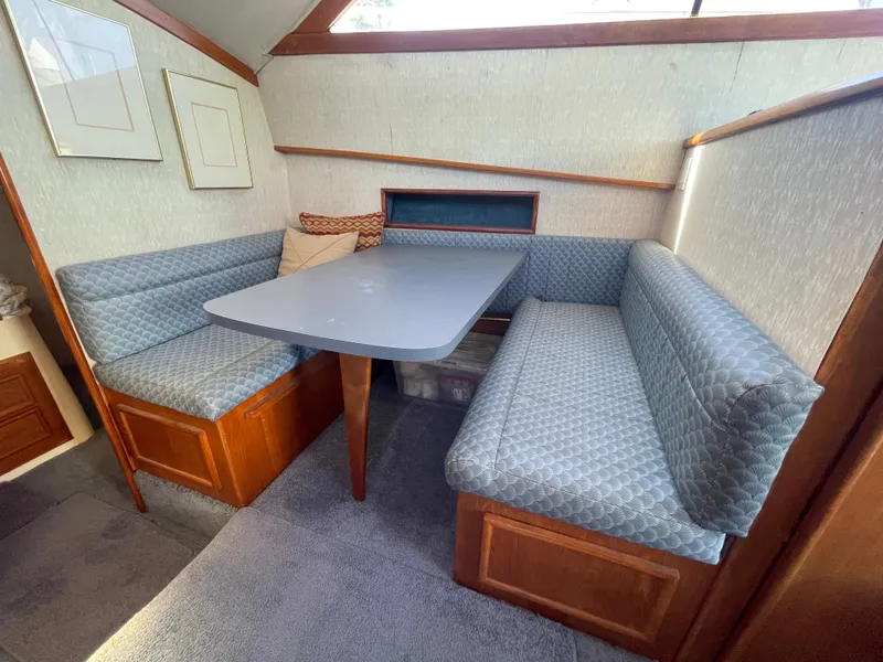 Slide: The Image of Interior of 1989 Ocean Yachts 35 Super Sport with kitchen and dining area. - 13
