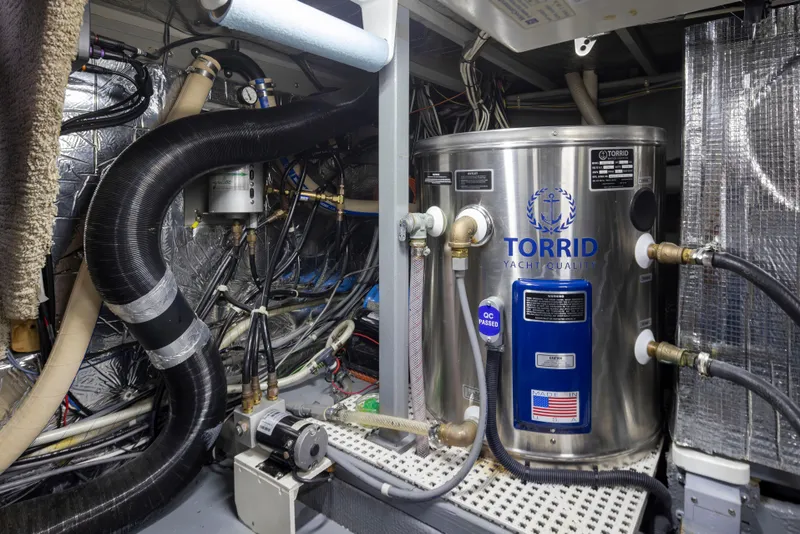 Slide: The Image of Engine room of 1990 Tollycraft 44 Cockpit Motor Yacht with Torrid water heater. - 38