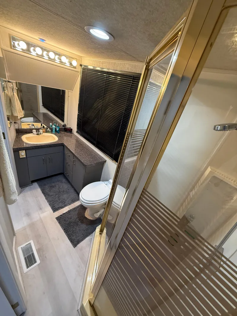 Slide: The Image of Bathroom interior of 1995 Skipperliner 52 Inter-Coastal Motor Yacht HB, featuring modern amenities. - 12