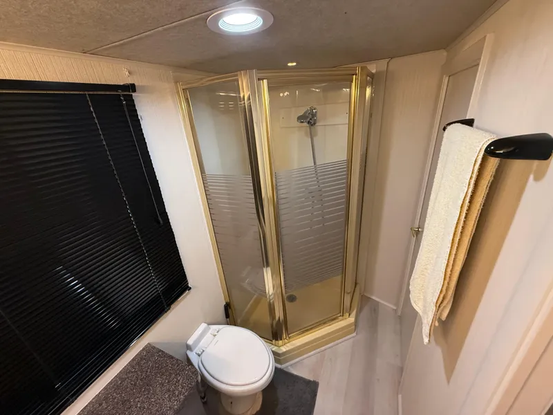 Slide: The Image of Bathroom of 1995 Skipperliner 52 Inter-Coastal Motor Yacht with shower and toilet. - 14