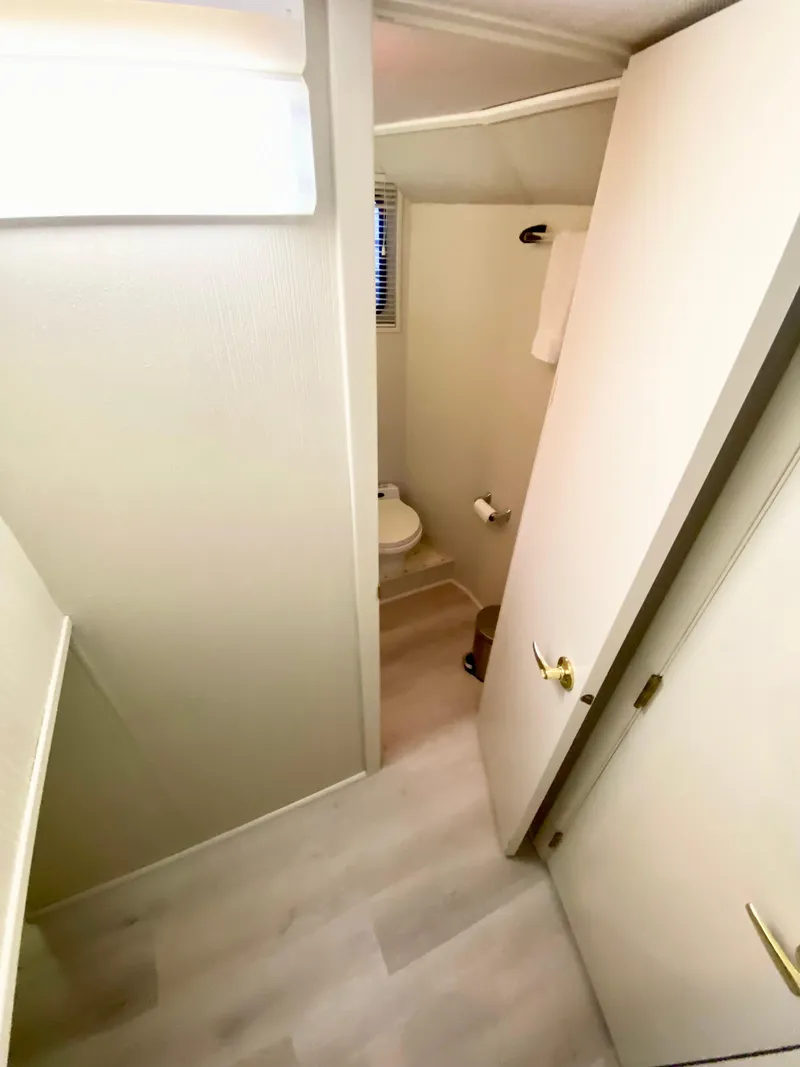 Slide: The Image of 1995 Skipperliner 52 yacht bathroom with modern fixtures and white interior. - 18