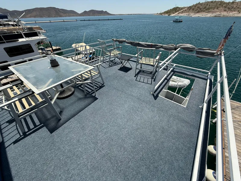 Slide: The Image of Upper deck of 1995 Skipperliner 52 Inter-Coastal Motor Yacht with seating, overlooking water. - 27