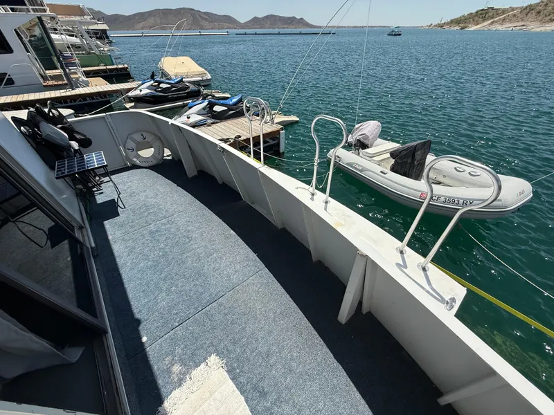 Slide: The Image of 1995 Skipperliner 52 Inter-Coastal Motor Yacht docked with inflatable boat nearby. - 30