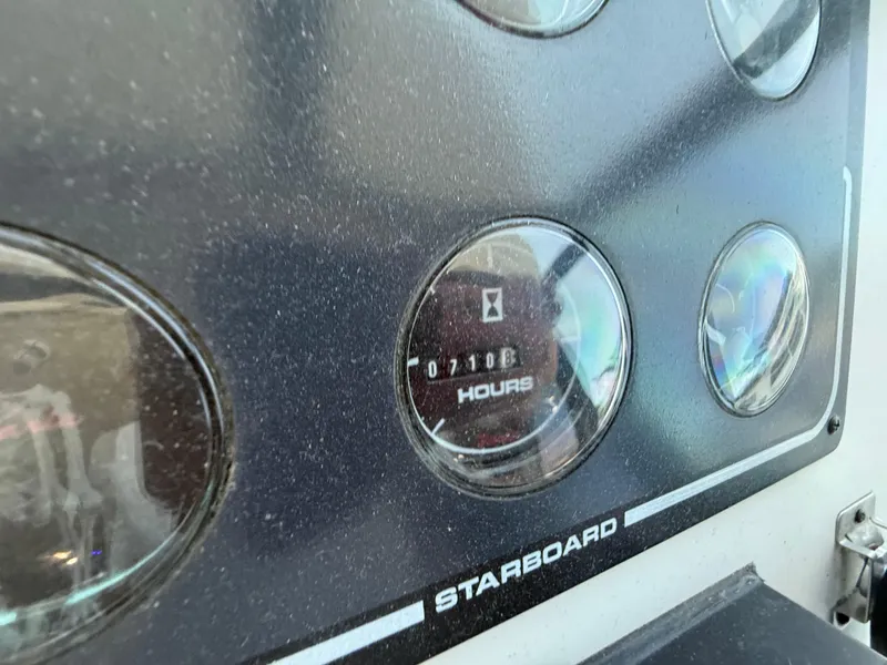 Slide: The Image of Close-up of Skipperliner 52 yacht dashboard showing 7108 hours on starboard gauge. - 32