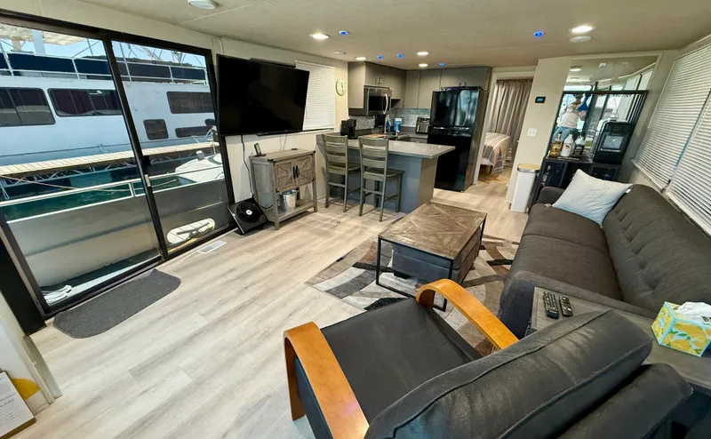 Slide: The Image of Interior of 1995 Skipperliner 52 Inter-Coastal Motor Yacht, featuring modern living area and kitchen. - 6