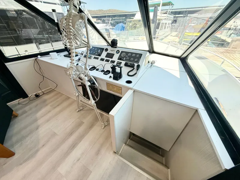Slide: The Image of Skeleton at helm of 1995 Skipperliner 52 Inter-Coastal Motor Yacht HB. - 8