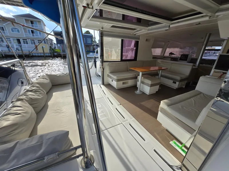 Slide: The Image of Spacious interior of 2018 Bali 4.1 Catamaran with comfortable seating and waterfront view. - 10
